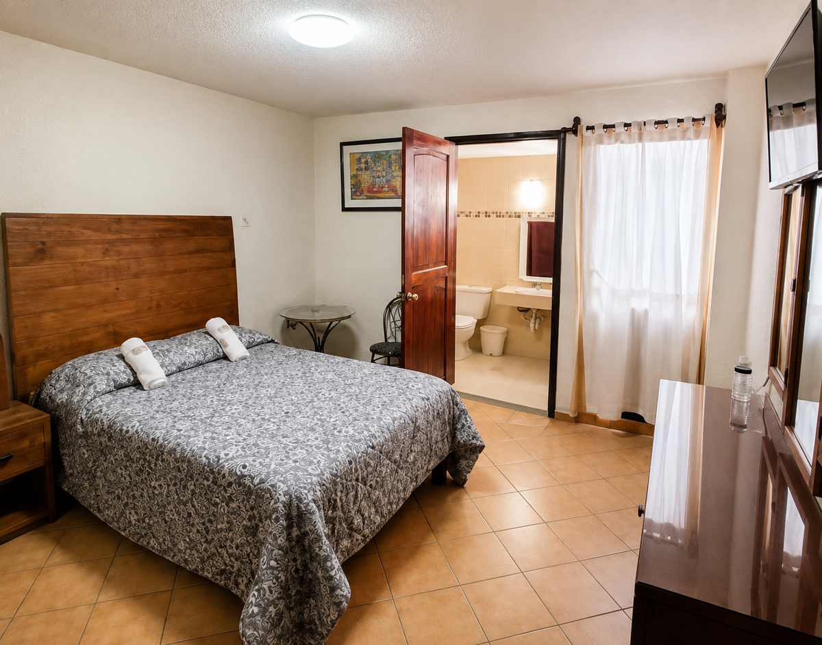 Habitación sencilla con una cama individual en el Hotel Maria Isabel de Iguala